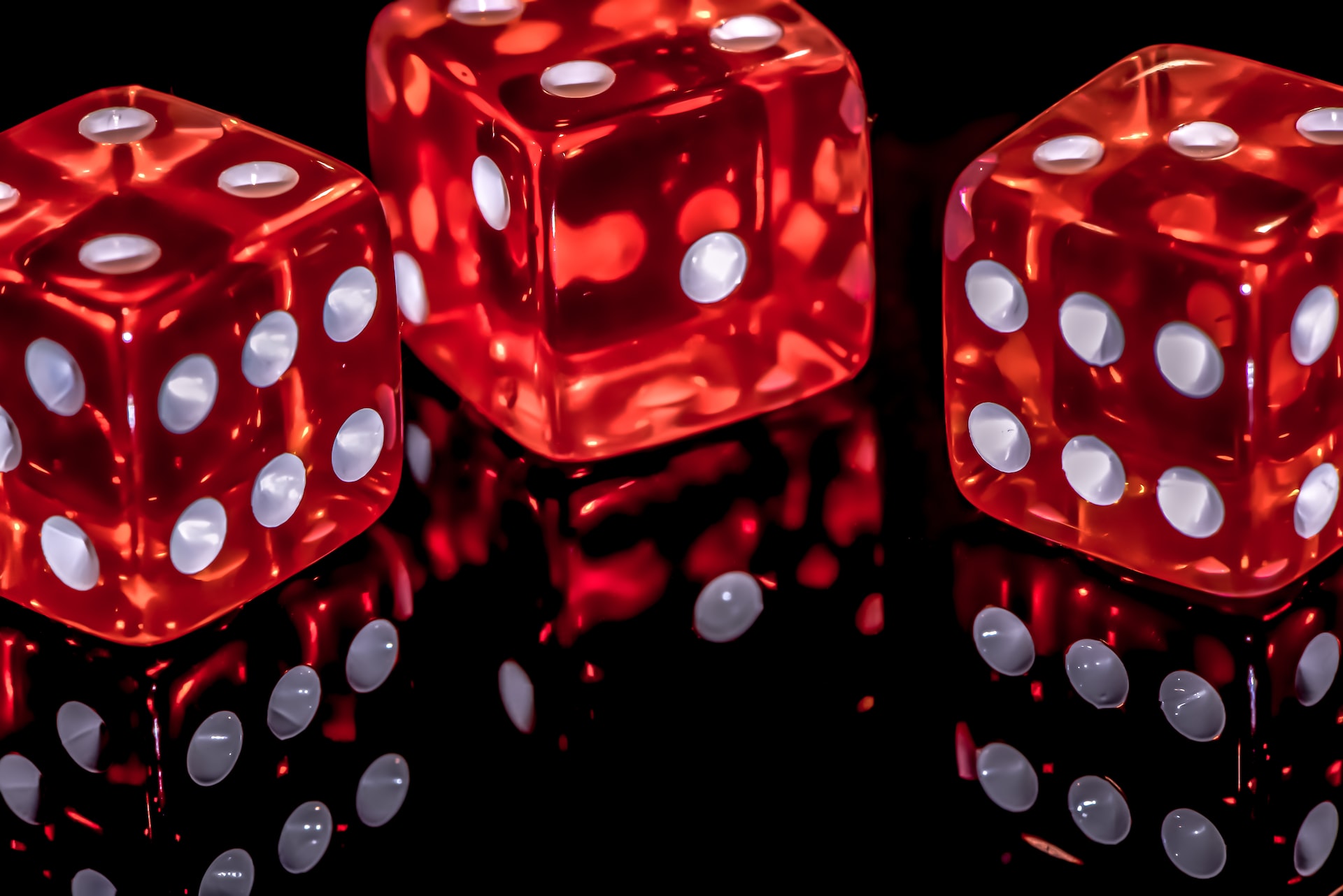Rolling dice — photo by Naser Tamimi on Unsplash